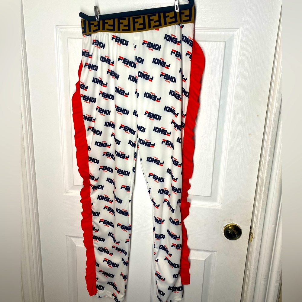 White Fendi pants with orange flare